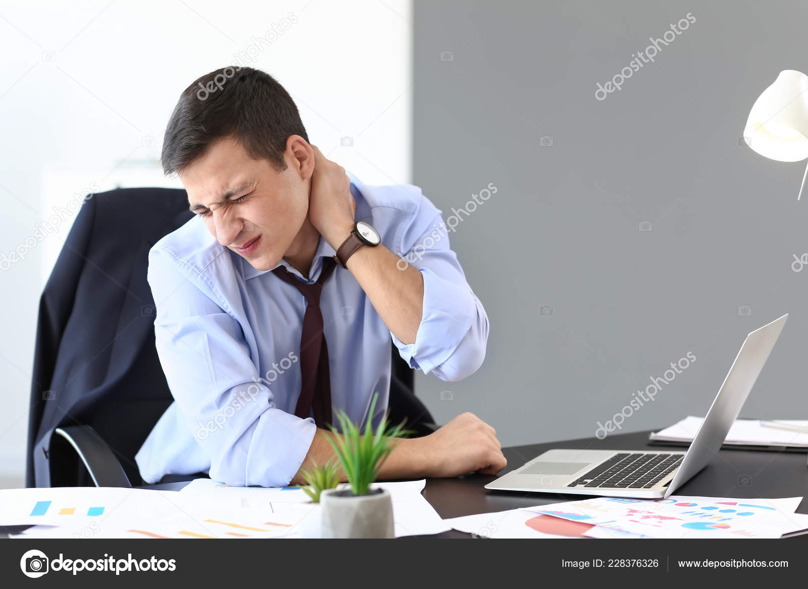 Young Businessman Suffering Neck Pain Office Stock Photo