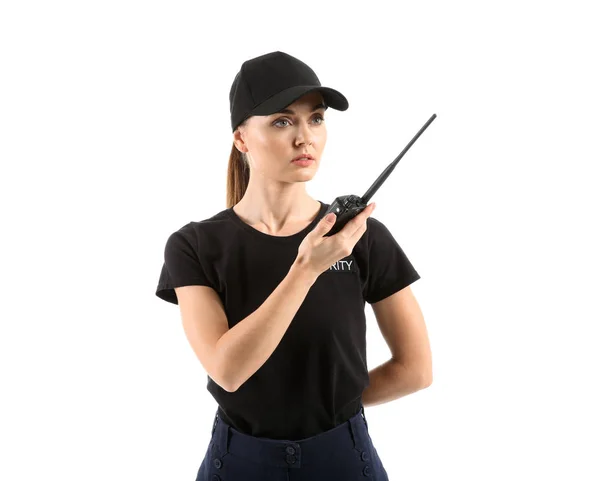 Female security guard with portable radio transmitter on white background