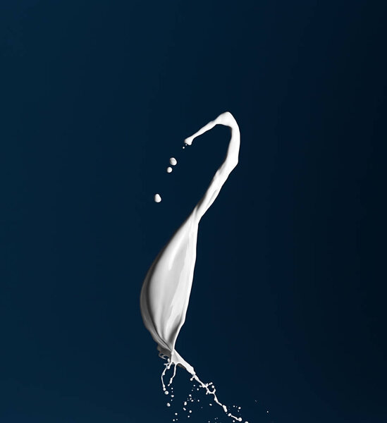 Splash of milk on dark color background