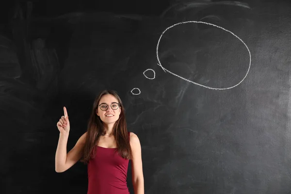 Young Woman Raised Index Finger Blank Speech Bubble Drawn Blackboard — Stock Photo, Image