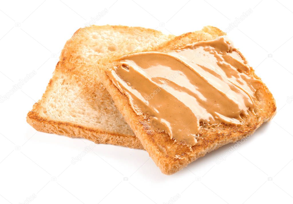 Toasts with peanut butter on white background