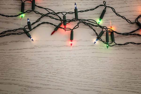 Glowing Christmas Lights Wooden Table — Stock Photo, Image