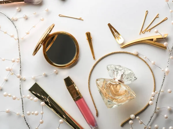 Flat lay composition with cosmetics and accessories on white background
