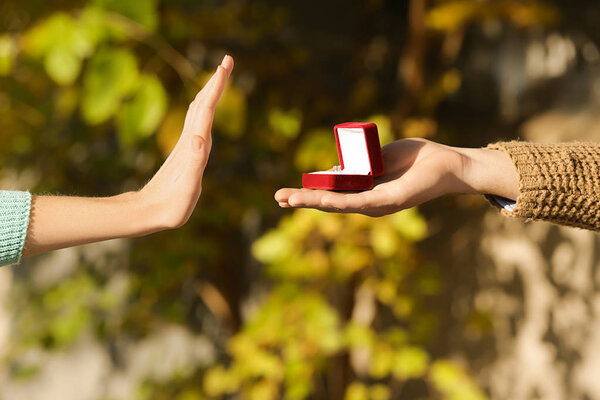 Young woman rejecting marriage proposal