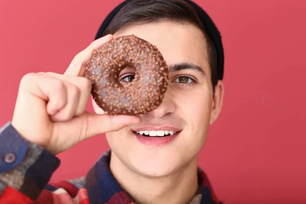 Young Man Tasty Donut Color Background — Stock Photo, Image