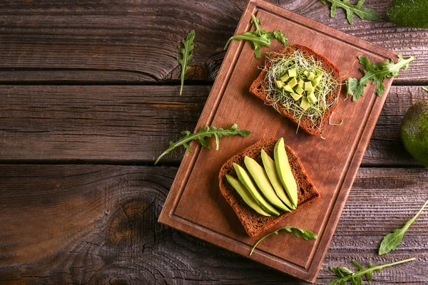 Wooden Board Delicious Avocado Toasts Table Top View — Stock Photo, Image