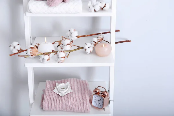 Warm Clothes Cotton Flowers Candles Shelves Light Wall — Stock Photo, Image