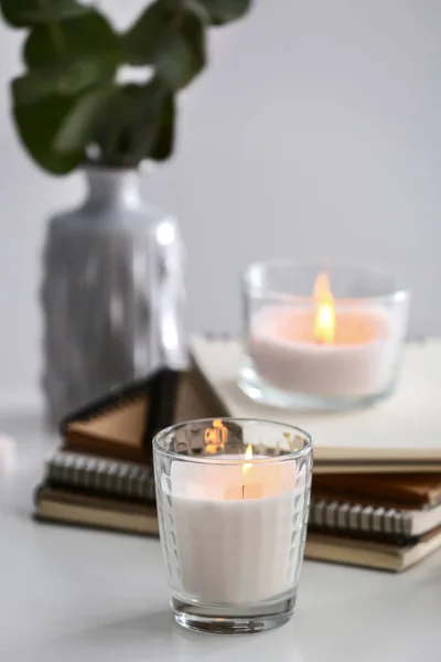 Burning Candles Notebooks Light Table — Stock Photo, Image