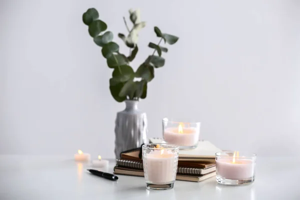 Burning Candles Notebooks Light Table — Stock Photo, Image