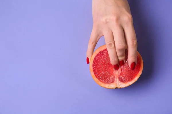 Female Hand Half Juicy Grapefruit Color Background Erotic Concept — Stock Photo, Image