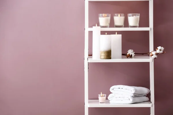 Many Burning Candles Shelves Color Wall — Stock Photo, Image