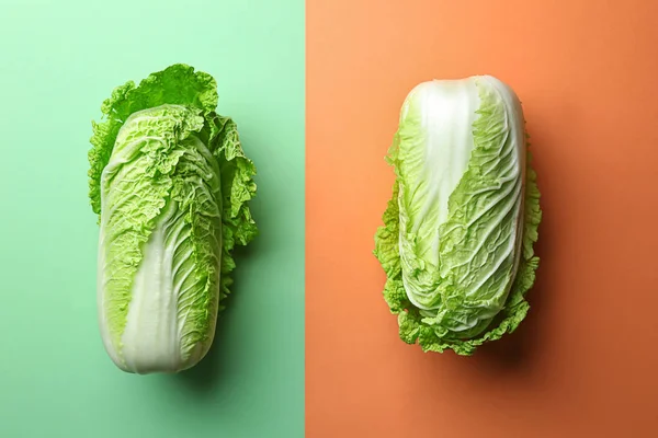Fresh cabbages on color background, flat lay