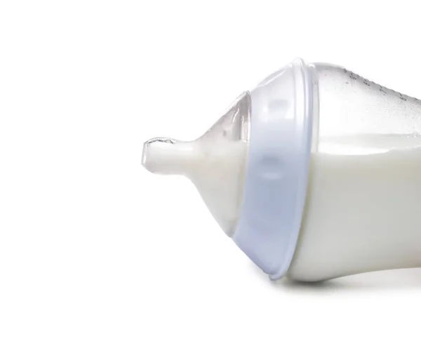 Feeding bottle of baby formula on white background