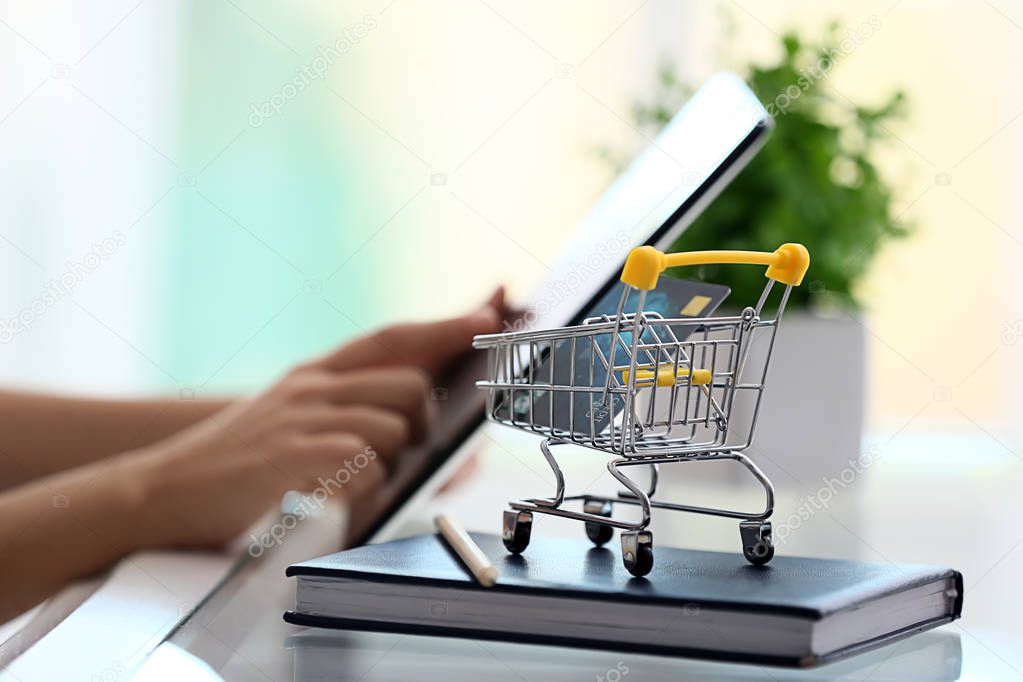 Woman shopping online with tablet PC at home