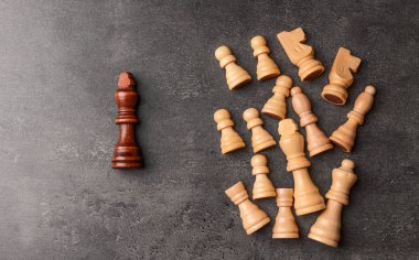 Chess pieces on grey background clipart