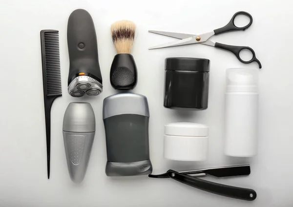 Flat lay composition with shaving accessories and cosmetics for men on white background