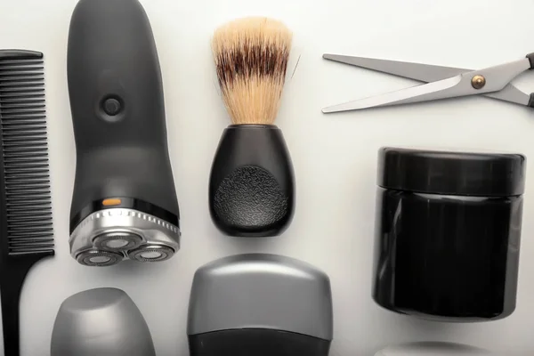 Flat lay composition with shaving accessories and cosmetics for men on white background