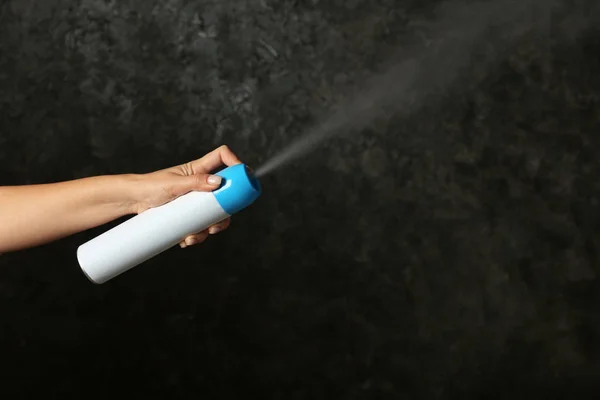 Woman Spraying Air Freshener Dark Background — Stock Photo, Image