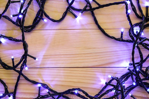 Glowing Christmas Lights Wooden Table — Stock Photo, Image