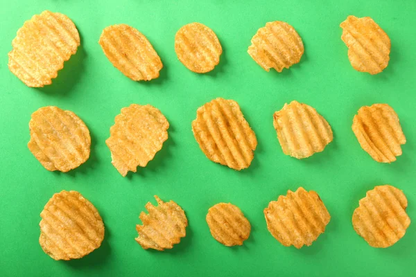 Tasty Crispy Potato Chips Color Background Top View — Stock Photo, Image