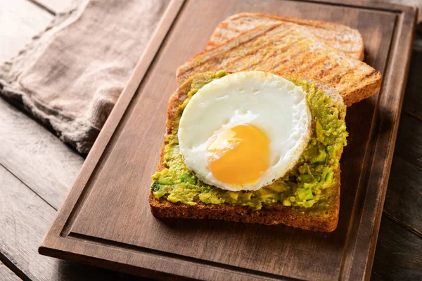 Tasty Toasted Bread Avocado Fried Egg Wooden Board — Stock Photo, Image