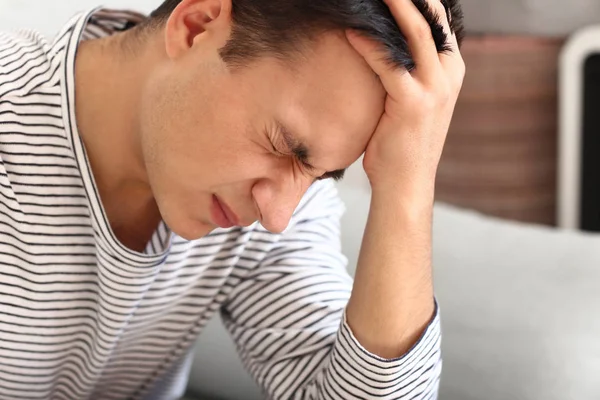 Young Man Suffering Headache Home — Stock Photo, Image