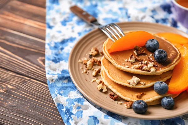 Hot Tasty Pancakes Sliced Persimmon Blueberries Walnuts Plate — Stock Photo, Image