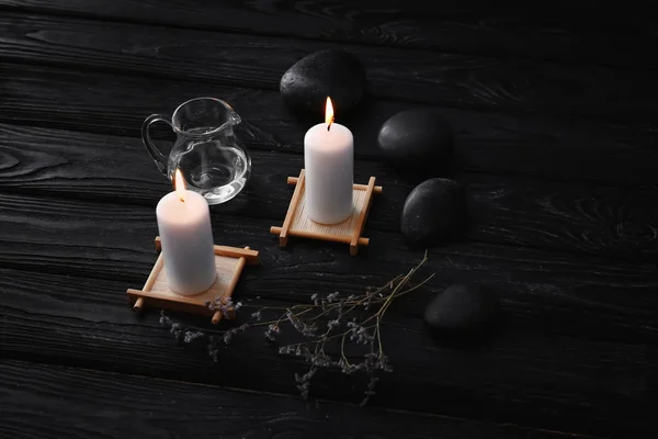 Beautiful Composition Burning Candles Spa Stones Dark Wooden Table — Stock Photo, Image