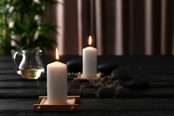 Beautiful Composition Burning Candles Spa Stones Dark Wooden Table — Stock Photo, Image