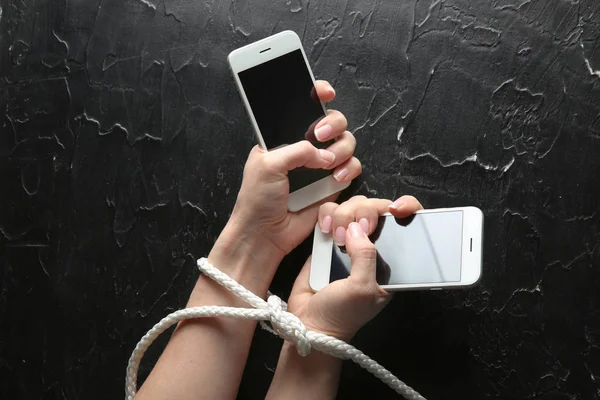 Woman Tied Hands Mobile Phones Dark Background Concept Addiction — Stock Photo, Image