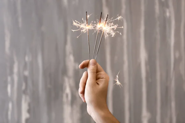 Woman Holding Christmas Sparklers Grey Background — Stock Photo, Image