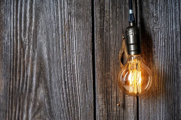 Glowing Light Bulb Wooden Background — Stock Photo, Image