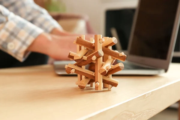Brain teaser on wooden table