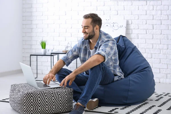 Young Man Laptop Sitting Beanbag Chair Home — Stock Photo, Image