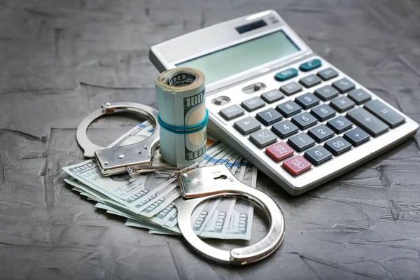 Dollar Banknotes Handcuffs Calculator Grey Table Corruption Concept — Stock Photo, Image