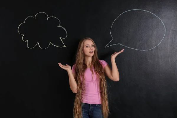 Confused Young Woman Blank Speech Bubbles Dark Background — Stock Photo, Image