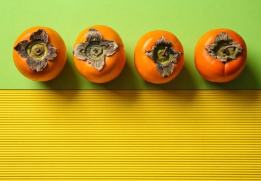 Lezzetli olgun hurma renk arka plan, üstten görünüm