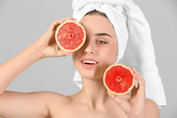 Beautiful Young Woman Eye Patches Grapefruit Light Background — Stock Photo, Image