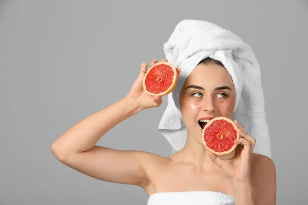 Beautiful Young Woman Eye Patches Grapefruit Light Background — Stock Photo, Image