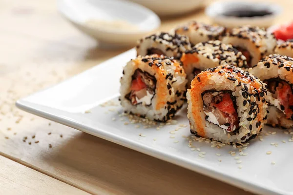 Plate Tasty Sushi Rolls Wooden Table — Stock Photo, Image
