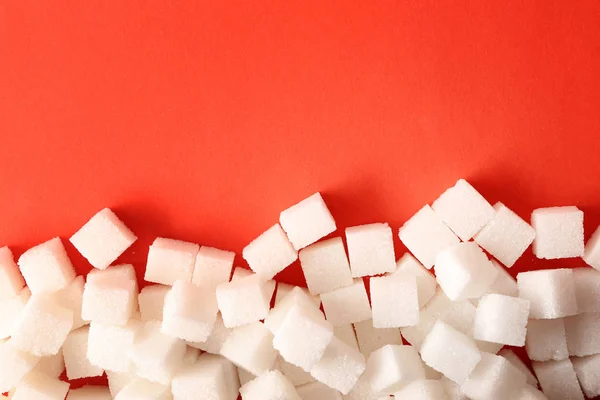 Sugar cubes on color background. Diabetes concept