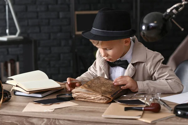 Cute Little Detective Reading Old Book Indoors — Stock Photo, Image