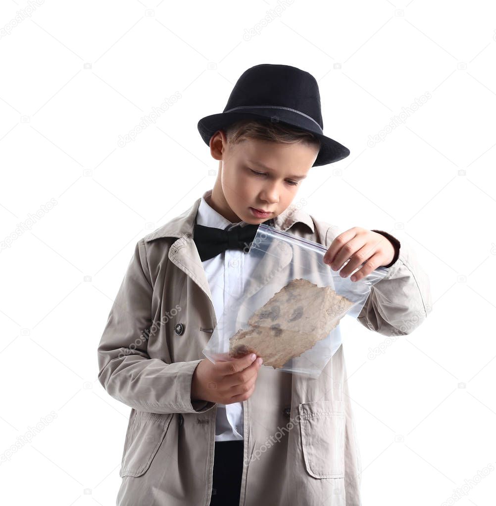 Cute little detective with evidence on white background