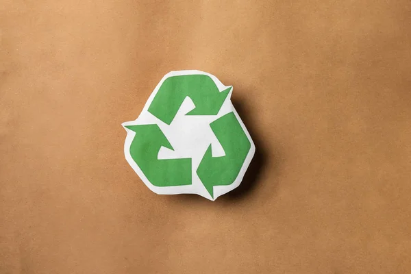 Recycling symbol on brown paper