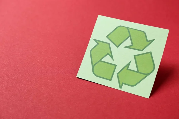 Recycling symbol on color background