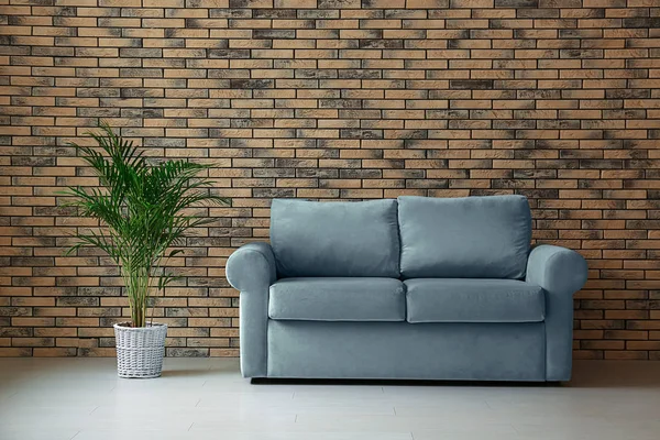 Comfortable Sofa Houseplant Brick Wall Room — Stock Photo, Image