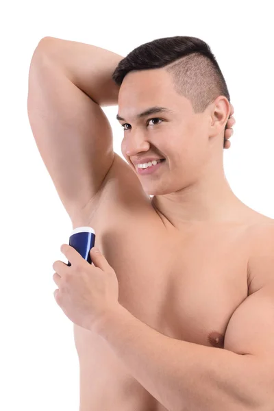 Ung Man Använder Deodorant Vit Bakgrund — Stockfoto