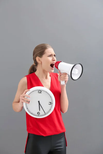 Young Woman Megaphone Clock Grey Background — Stock Photo, Image