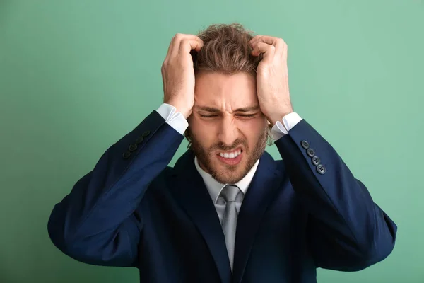 Young Businessman Suffering Headache Color Background — Stock Photo, Image