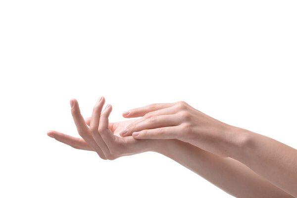 Hands of woman with soft skin after applying cream on white background